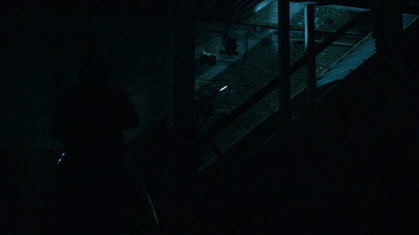 ESU team inside abandoned warehouse.