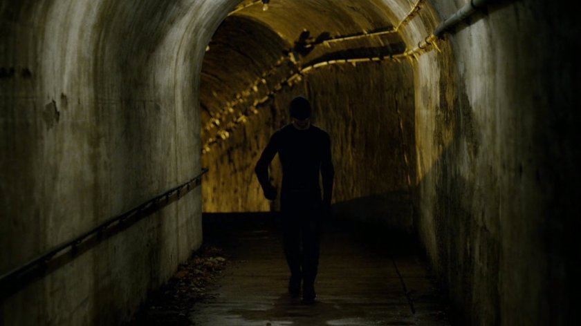 Daredevil in access tunnels under an abandoned warehouse.