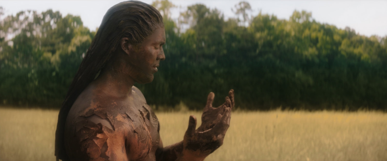 One of the original Choctaw standing in a field.