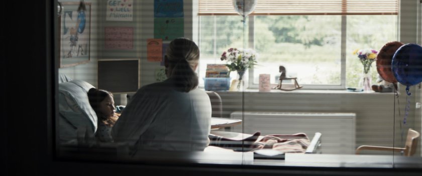 Young maya and a nurse in a hospital room.