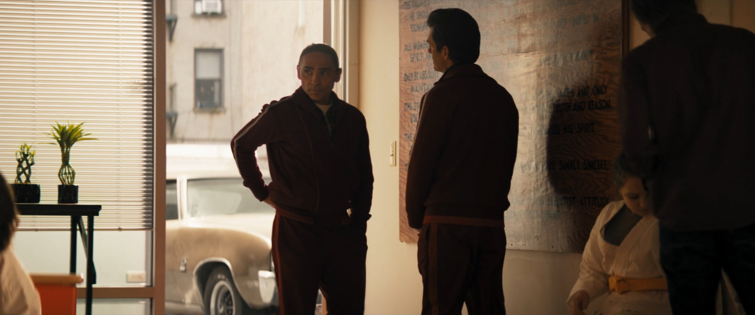 William and track suited man in Brooklyn karate studio.