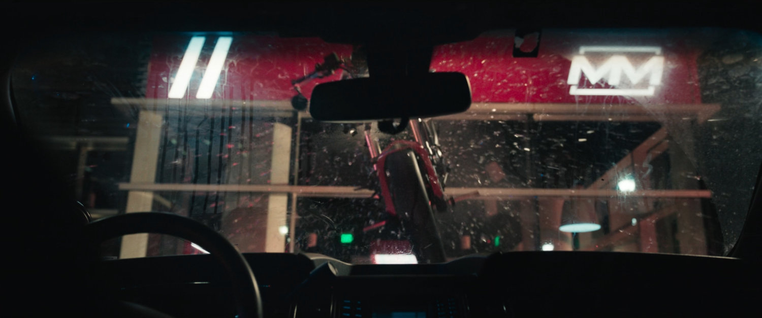 Motorcycle crashing through window of a New York motorcycle showroom.
