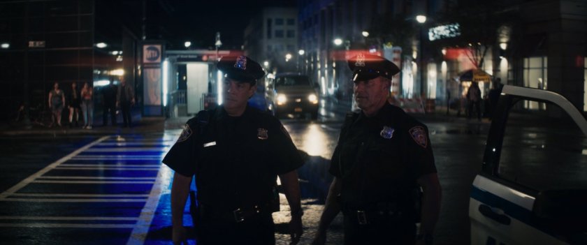 Police officers outside motorcycle showroom.
