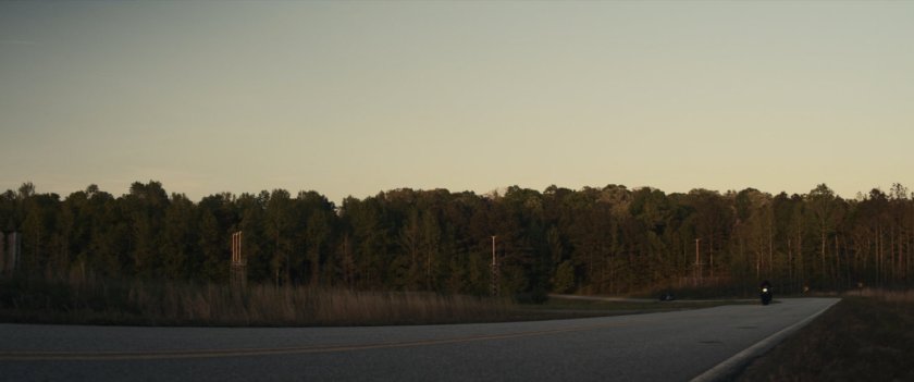 Motorcycle on country road.