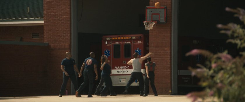 People playing basketball outside Tamaha Fire Department.