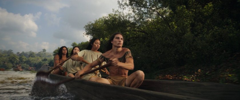 Choctaw in canoe on river.