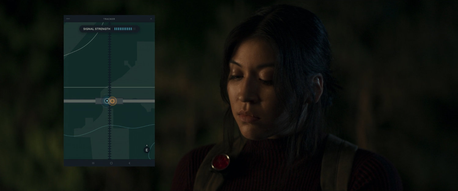 Maya looking at tracker map on her phone.