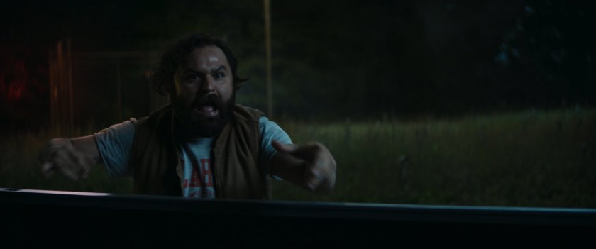 Biscuits by pickup in field at night.