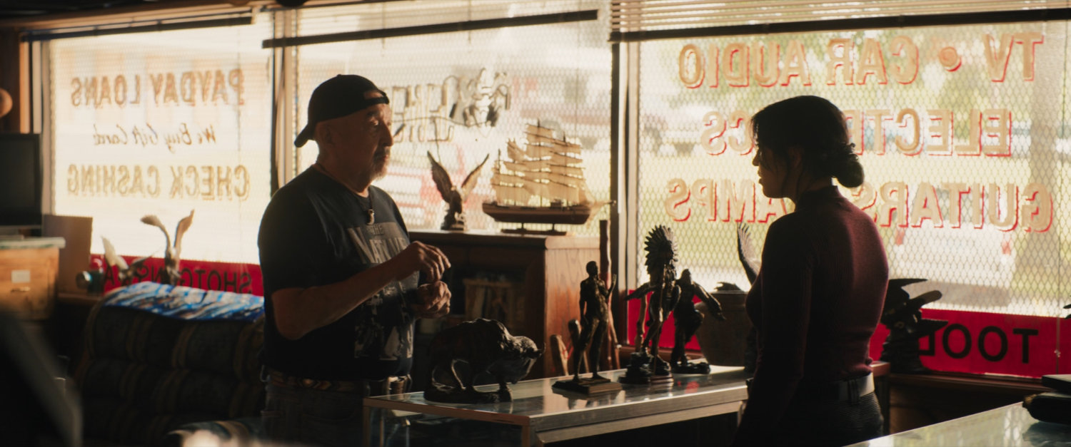 Skully and Maya inside Skully's Pawn shop.