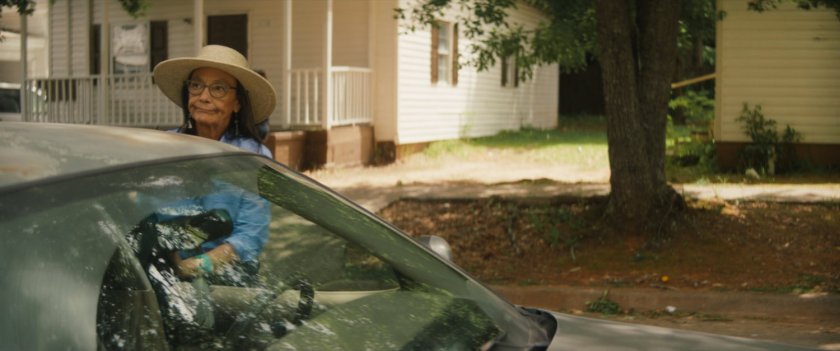 Chula exits a car on a Tamaha street.