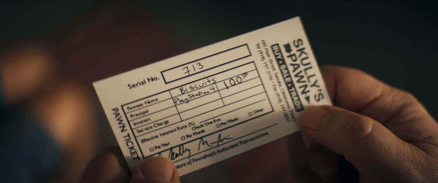 Close-up of Skully's Pawn Shop ticket.