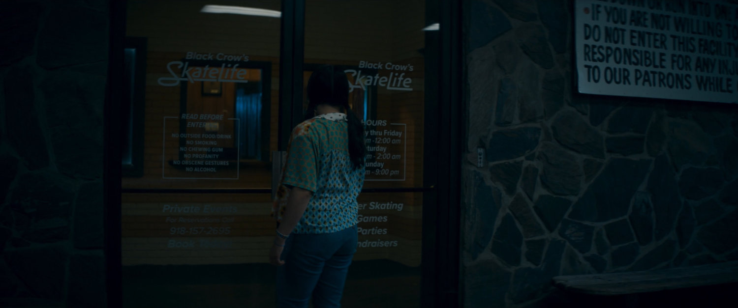 Bonnie at front door of Black Crow's SkateLife Roller Skating.