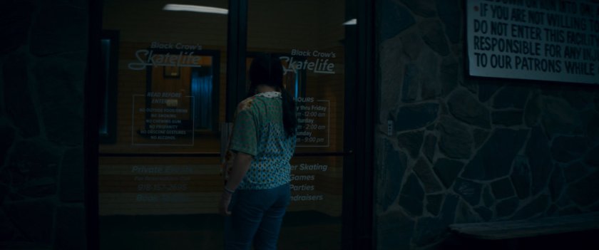 Bonnie at front door of Black Crow's SkateLife Roller Skating.