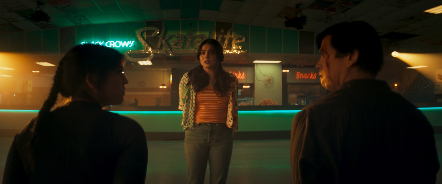 Maya, Bonnie, and Henry inside of Black Crow's SkateLife Roller Skating.
