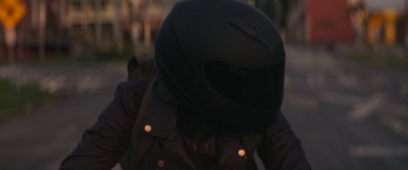 Closeup of Maya on her motorcycle in downtown Tamaha.