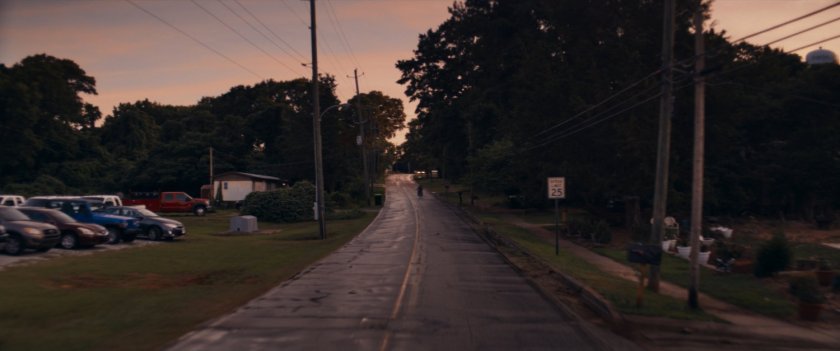 Maya riding motorcycle up Tamaha road.