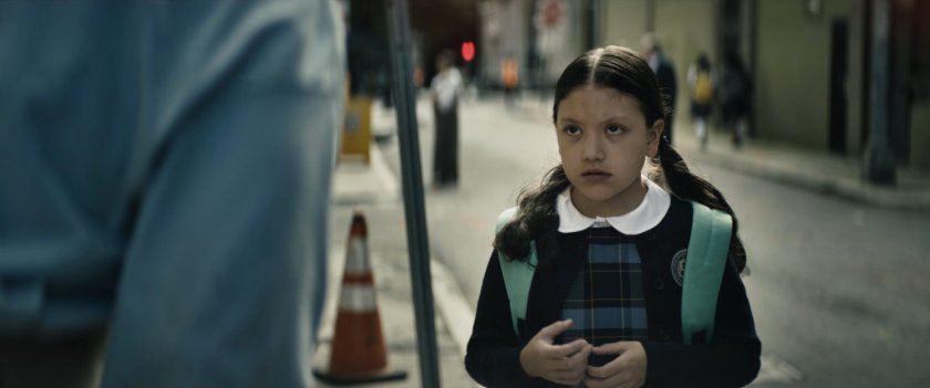 Young Maya on New York street outside private school.