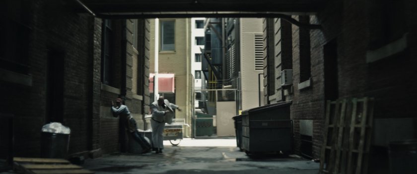 Kingpin throws ice cream vendor against an alley wall outside a private school.