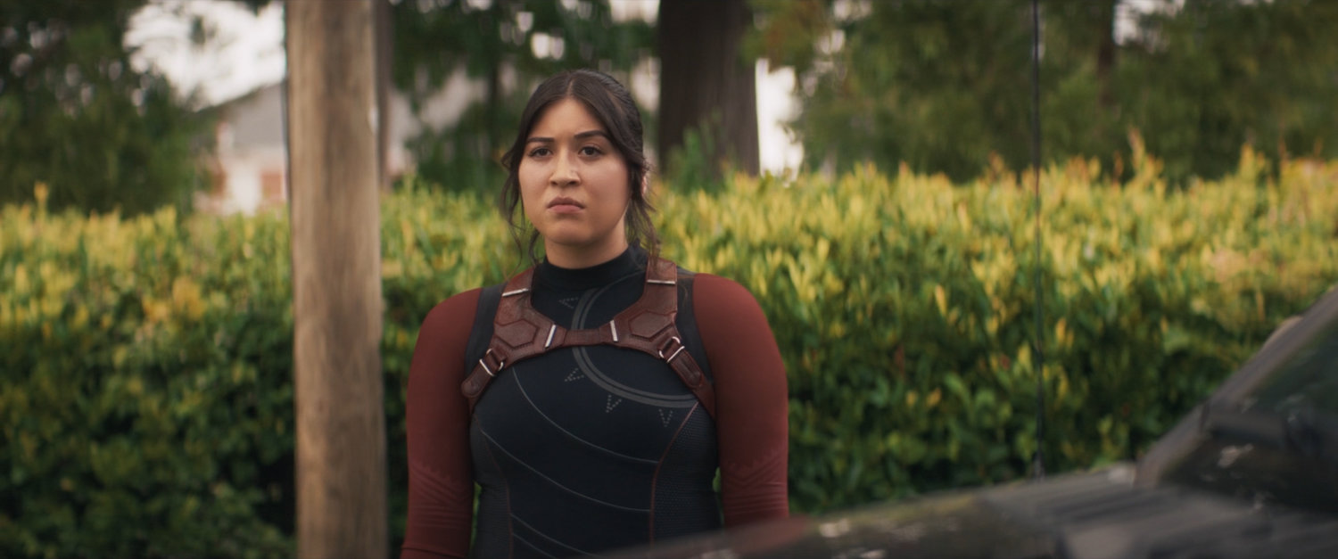 Maya standing outside of Chula's house.