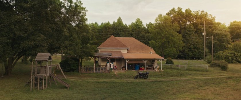Exterior of Lopez House with playset.