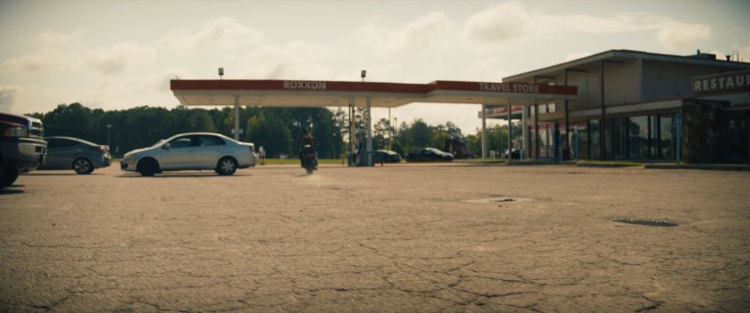 Maya riding away from Maya inside Roxxon Travel Store..