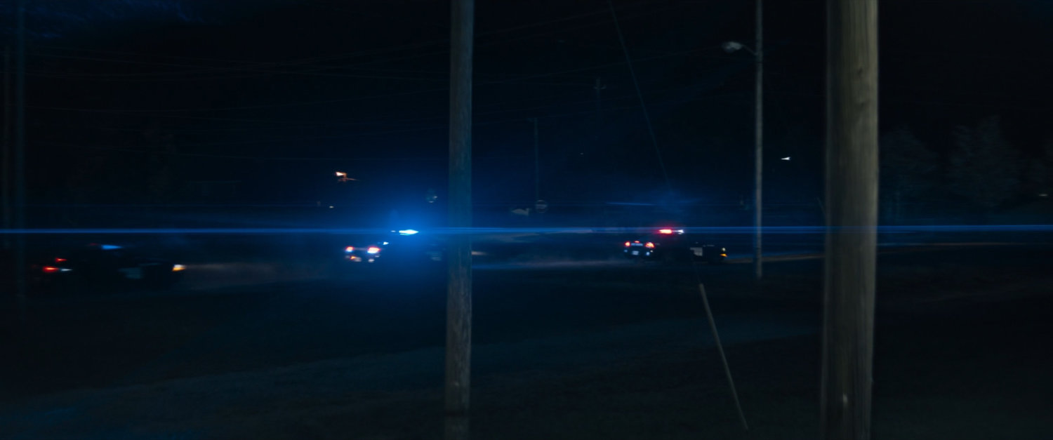 Police cars arriving at the Choctaw Nation PowWow at night.