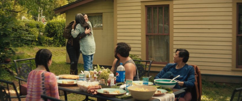 Maya hugging Chula in Chula's backyard.