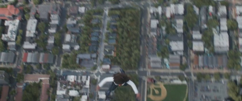 Monica flying above Jersey City baseball field.