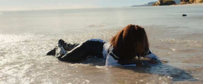 Monica in the water on an Aladna beach.
