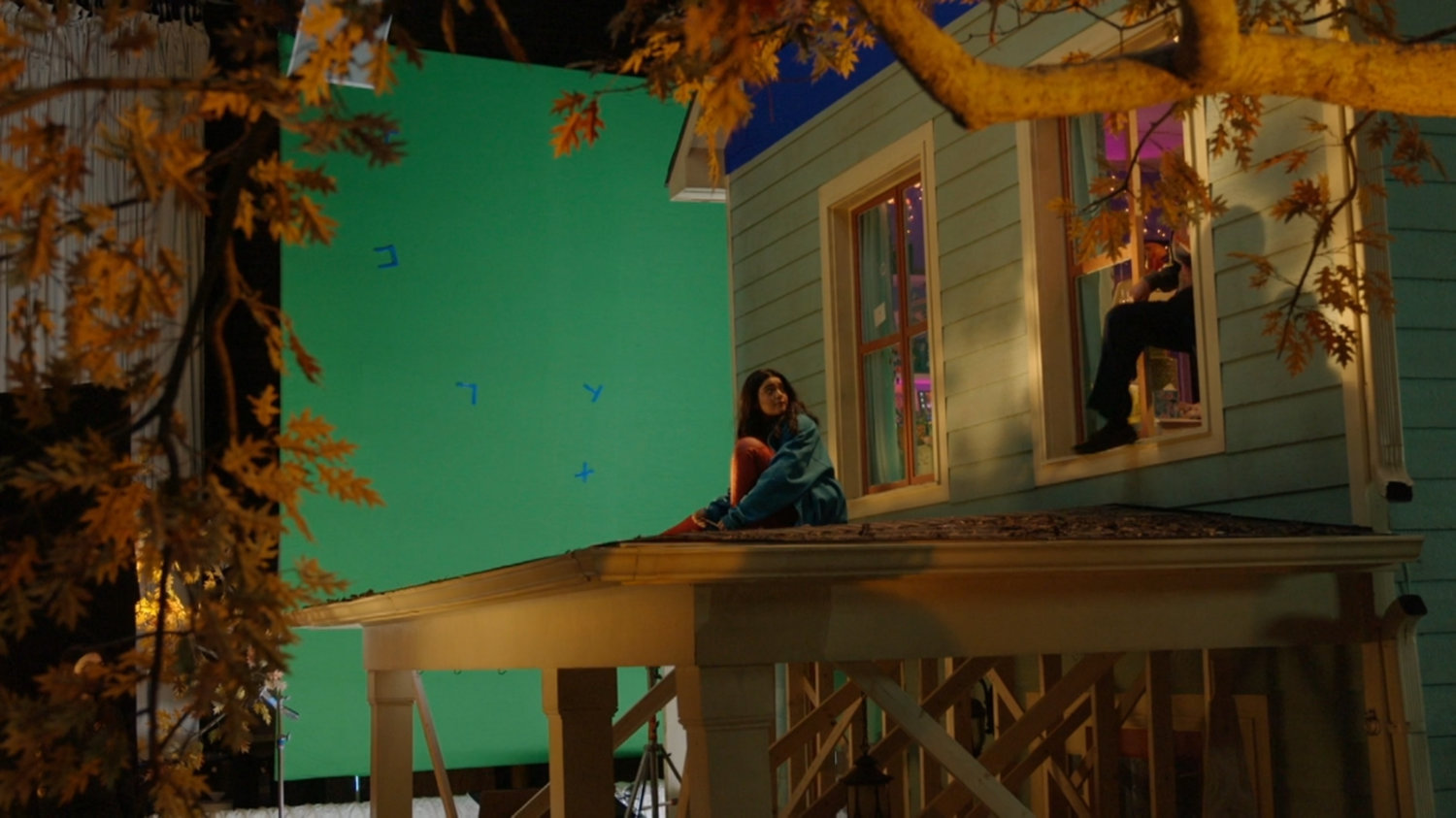 Behind-the-scenes filming of the Khan house on a soundstage.