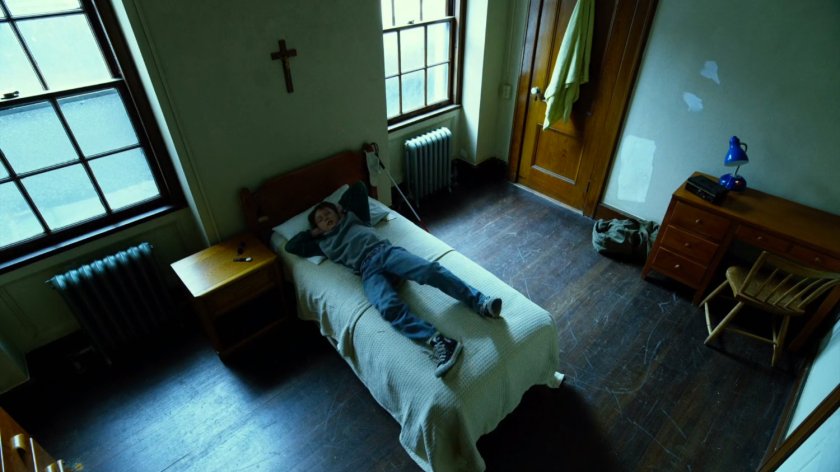 Young Matt in orphanage bed.