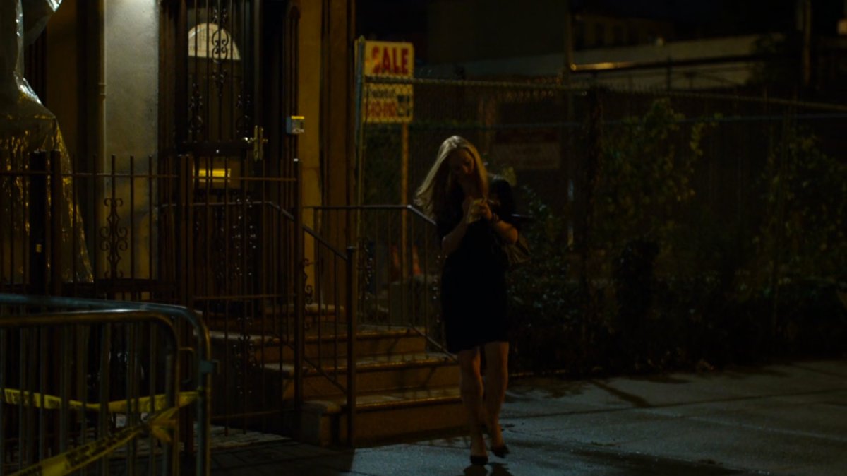 Karen outside Elena Cardenas' apartment.