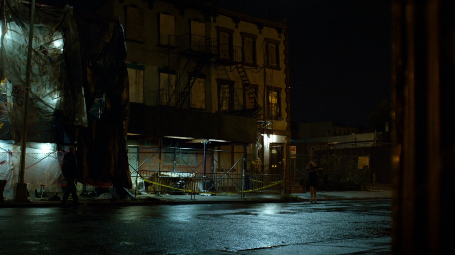 Karen crosses dark street outside Elena Cardenas' apartment.