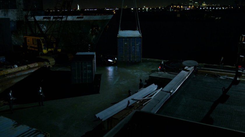 A container holding Black Sky is offloaded from a ship at the docks.