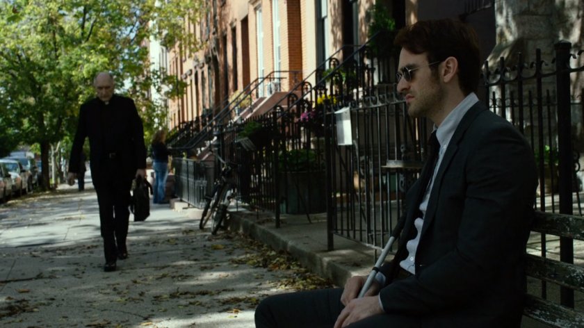 Father Lantom approaches Matt outside church.