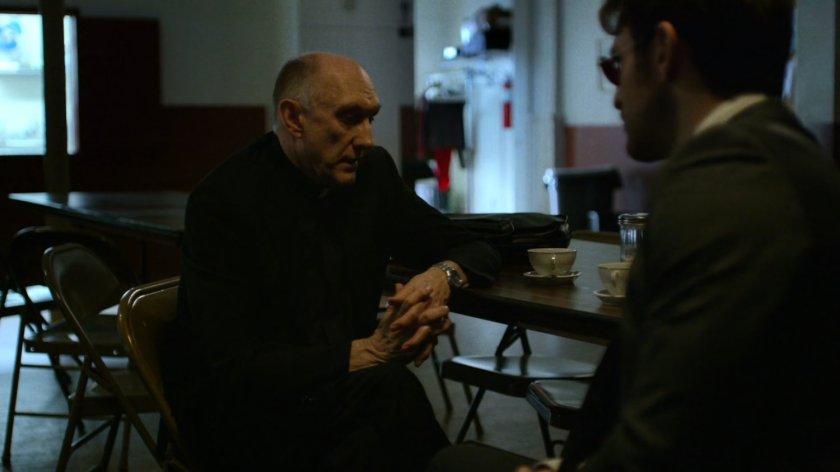 Matt and Father Lantom in church kitchen.