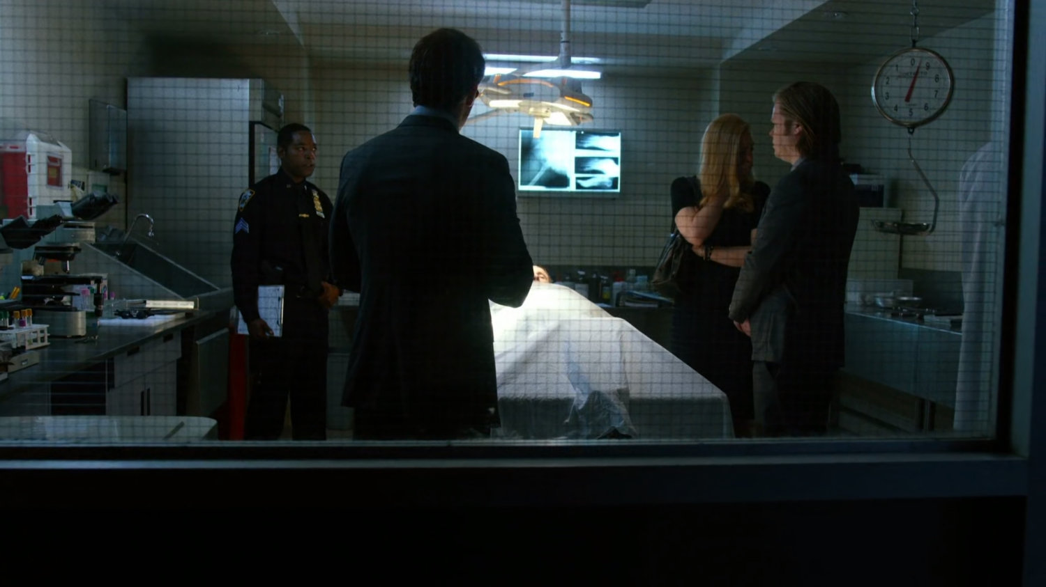 Matt, Foggy and Karen in Medical Examiner's autopsy room identifying a body.