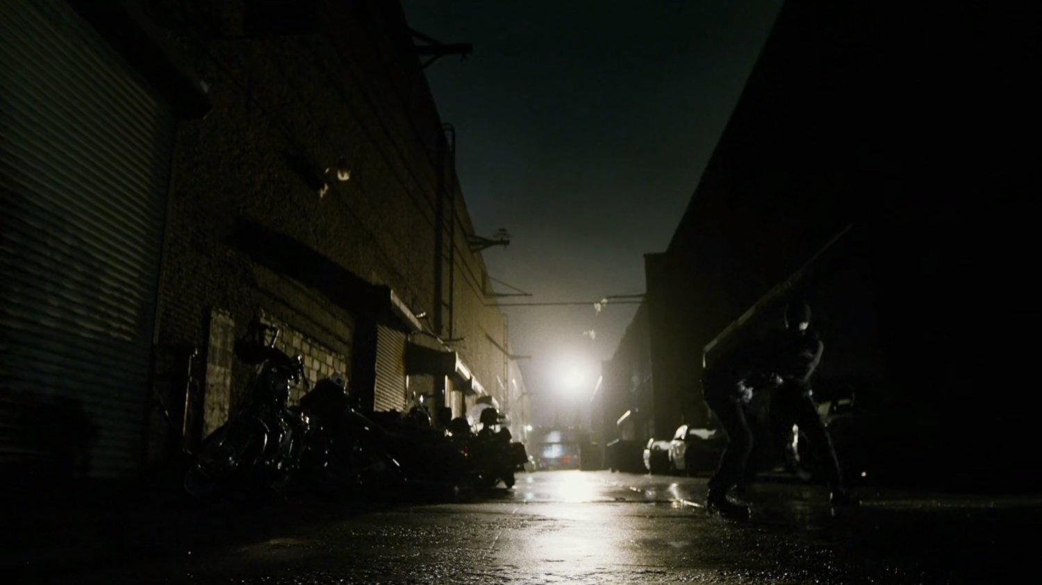 Daredevil beats up man in dark alley.