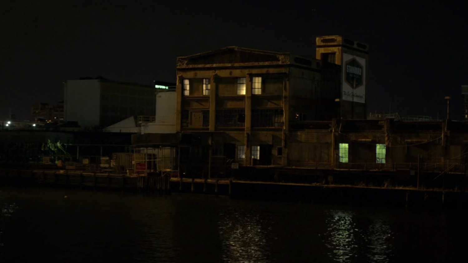 Nighttime exterior of warehouse at Pier 81.