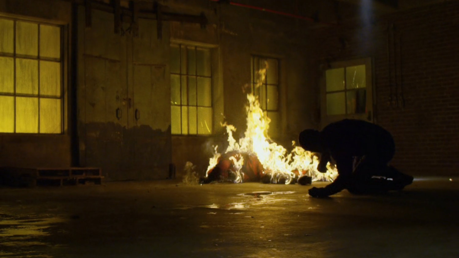 Nobu burns near Daredevil inside warehouse at Pier 81.