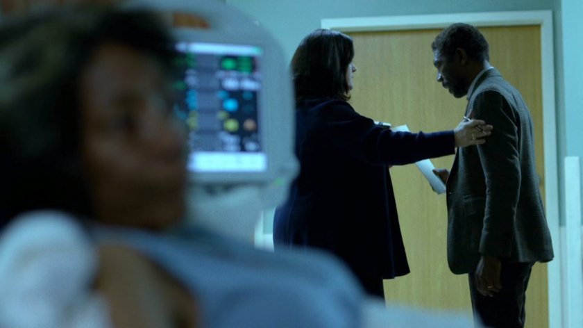 Ben Urich talks to Shirley outside a Metro-General hospital room.