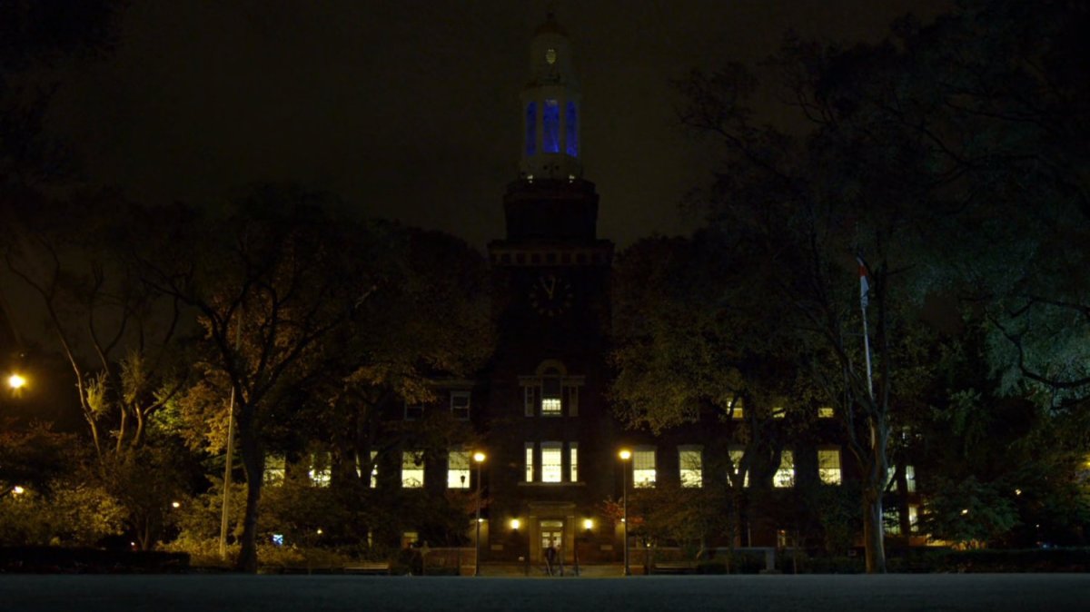 College-aged Matt and Foggy in college quad at night.