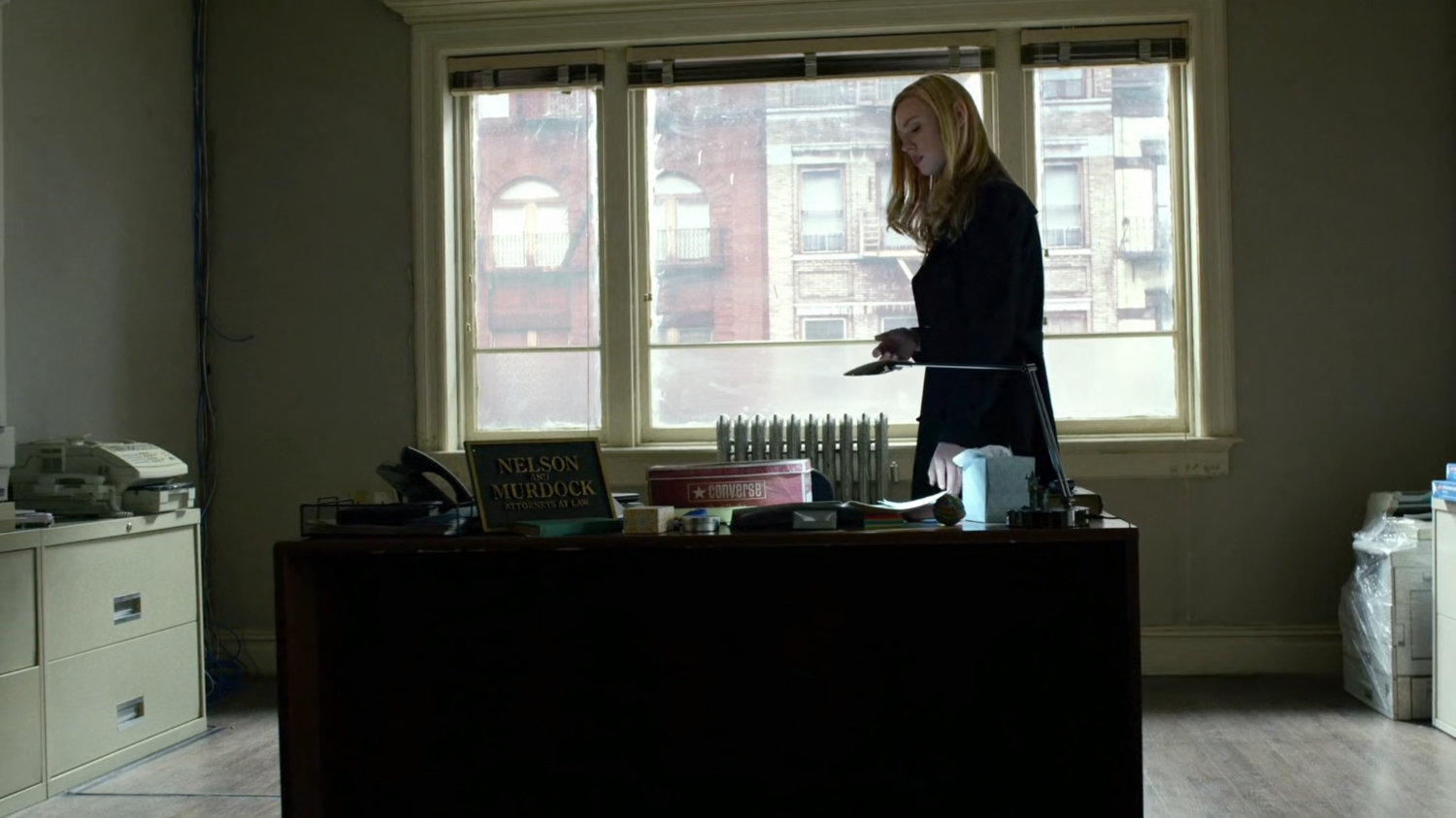 Karen inside Nelson and Murdock offices.