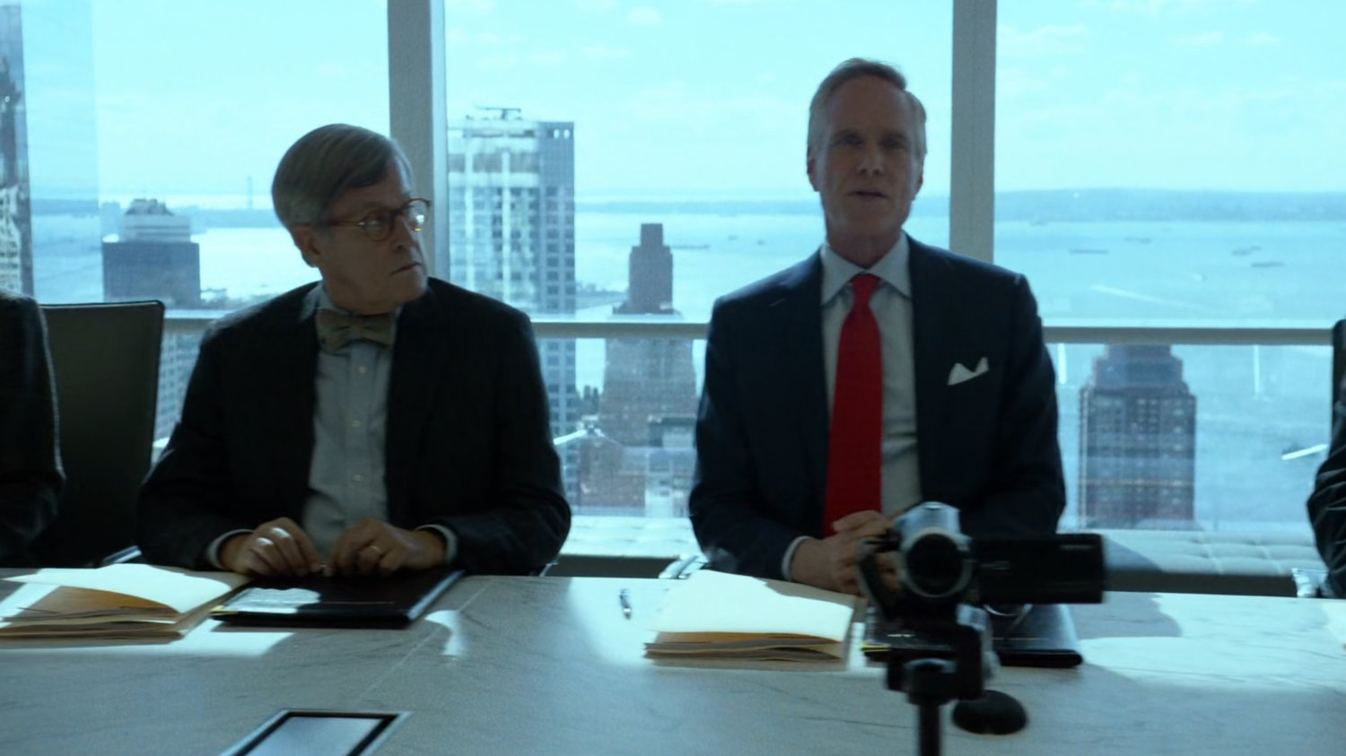 Lawyers inside meeting room at Landman and Zack.