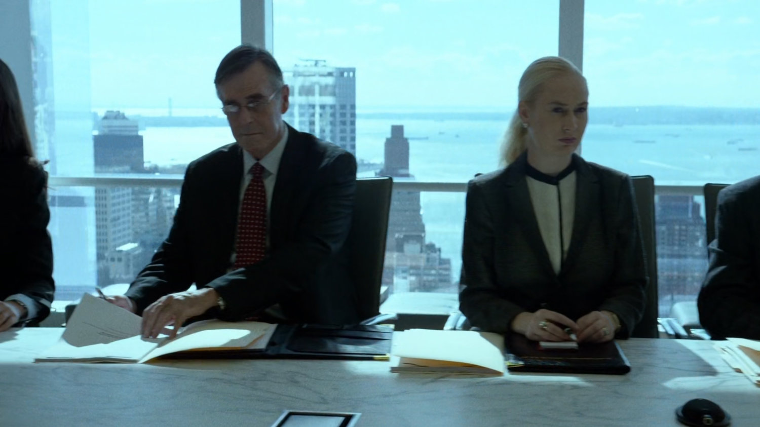 Lawyers inside meeting room at Landman and Zack.