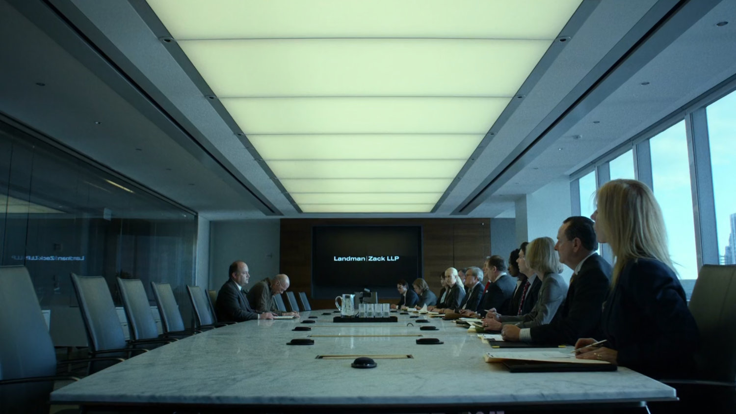 Lawyers inside meeting room at Landman and Zack.