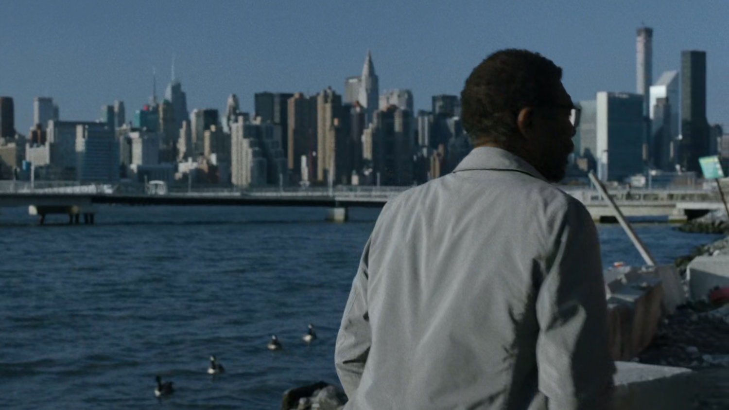 Ben standing by the East River.