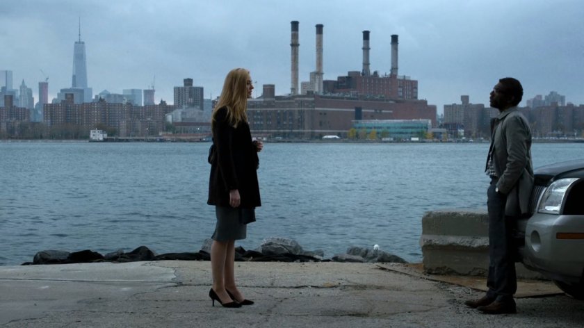 Karen and Ben standing by the East River.