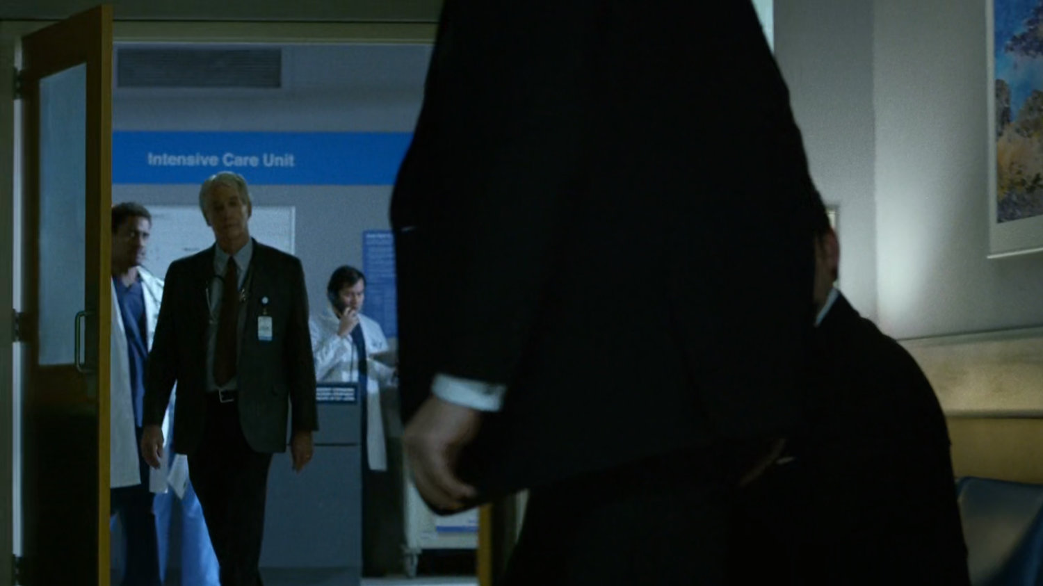 Wilson Fisk and Wesley in a Metro-General hospital hallway.