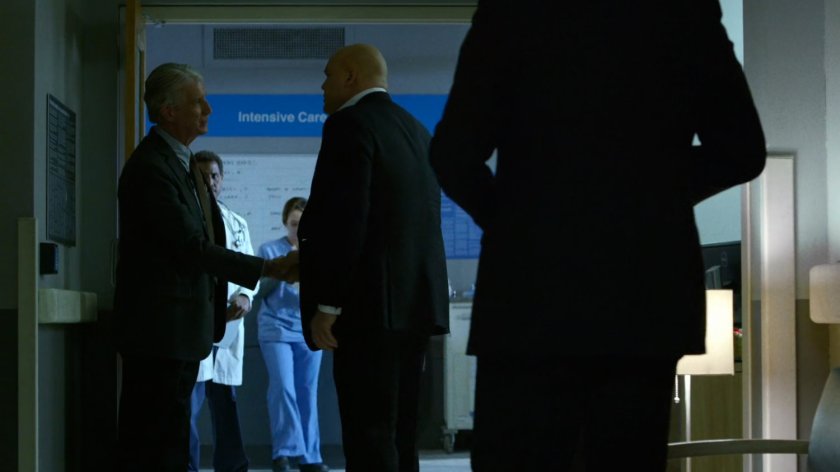 Wilson Fisk and a doctor in a Metro-General hospital hallway.